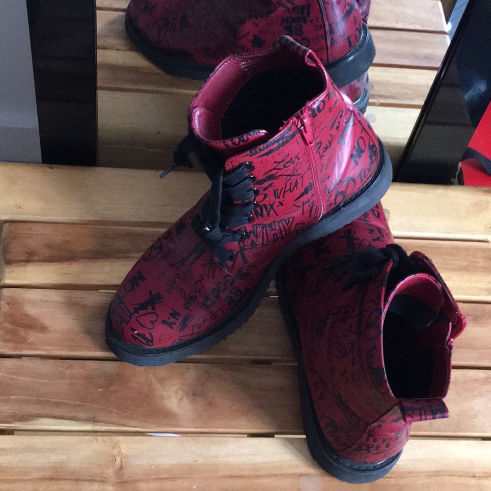 red aldo shoes with words on it
